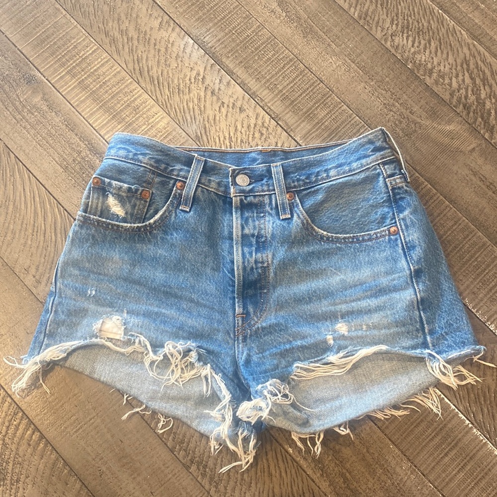 Medium wash Levi jeans 501 shorts. Lightly worn.